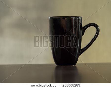 Clean clack coffee mug cup on table vintage tone.