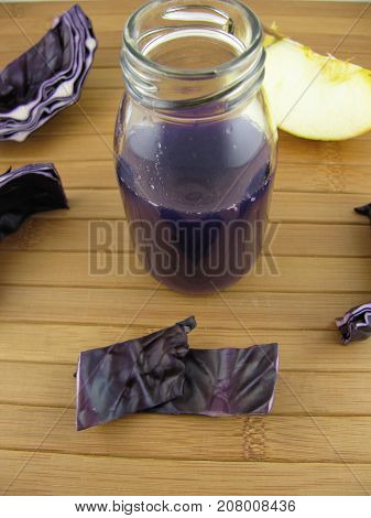 Red cabbage smoothie with apple in a bottle