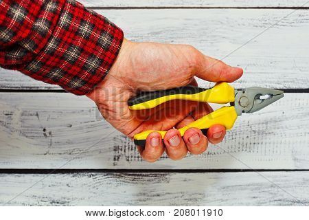 Male Person Holding Pliers Tool In Hand