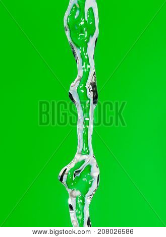 a jet of water on a green background