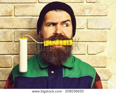Bearded Painter Man Holding Roller Paint With Serious Face
