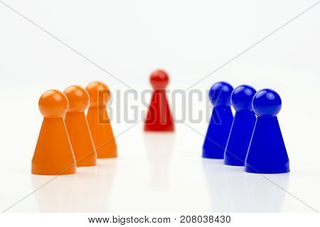 Close-up photo of a group of different-colored pieces in different positions on a white background - applicable to the team view