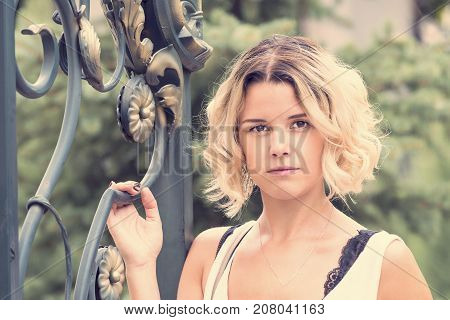 Portrait of a girl in a summer park outdoors