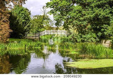 An ornamental footbridge on the river Greta Ouse in godmanchester.