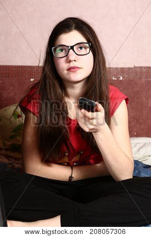 Teen Girl In Short Sight Glasses Watch Tv Movie With Remote Control