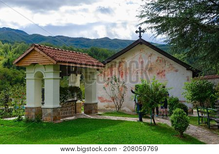 MONASTERY OF MORACA MONTENEGRO - SEPTEMBER 12 2017: Unknown tourists visit Church of St. Nicholas and belfry in Monastery of Moraca Montenegro