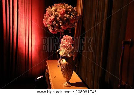 a small and big designed flower pot with beautiful flowers