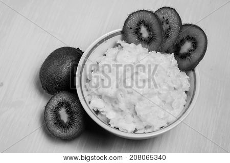Porridge with kiwi on breakfast black and white poster