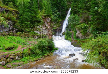 Cavalese waterfall in a valley Val di Fiemme.South Tyrol,Italy.