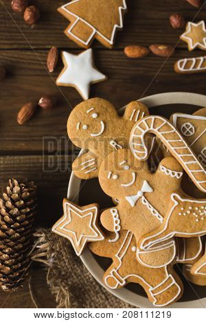 Ginger men on a wooden background. Gingerbread. Christmas cookies