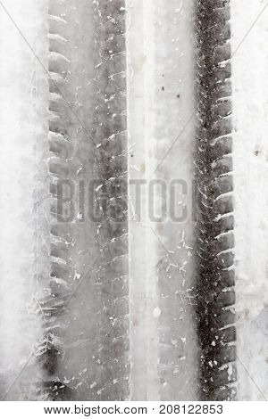 Track On The Road Covered With Snow In The Winter Season. Photo Taken Close Up