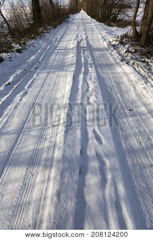 Snow-covered Road In The Winter Season. Close-up Photo