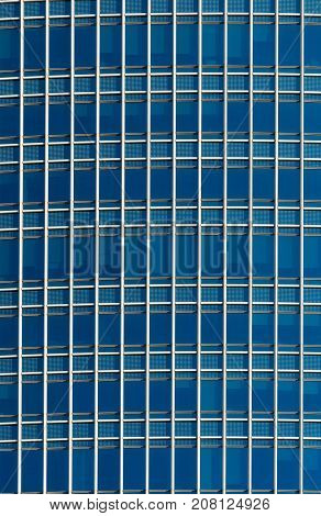 Closeup detail modern glass office building background artchitecture concept