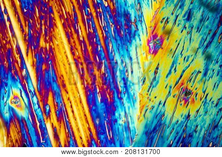 microscopic shot of urea micro crystals in polarized light