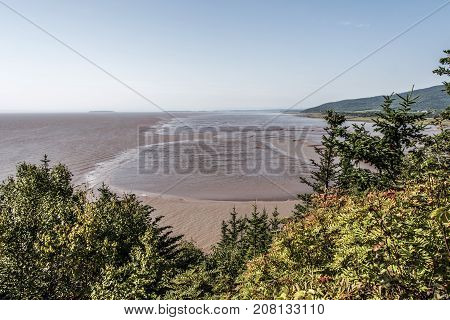 Low Tide Beach On Bay Of Fundy New Brunswick - Canada Brown Colored Water Called Chocolate River