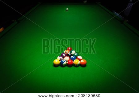 Billards pool game. Green cloth table with coloful balls