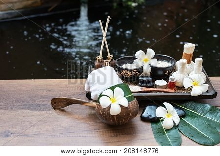 Spa massage compress balls herbal ball on the wooden with treaments spa Thailand select focus