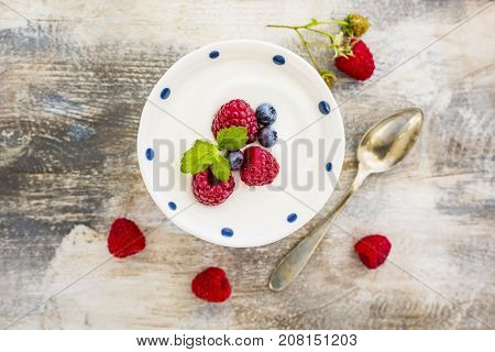 A bowl of healthy and delicious yogurt with fresh berry fruits.