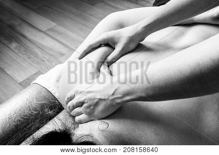 Physiotherapist, Chiropractor Giving A Massage And Stretching Of Subscapularis And Rhomboid To A Pat