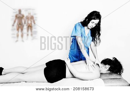 Physiotherapist, Chiropractor Giving A Massage And Stretching Of Subscapularis And Rhomboid To A Pat