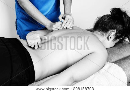 Physiotherapist, Chiropractor Giving A Massage And Stretching Of Subscapularis And Rhomboid To A Pat