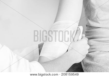 Compression Bandage To Inflammation, Application A Spiral Bandage. Application A Spiral Bandage In S