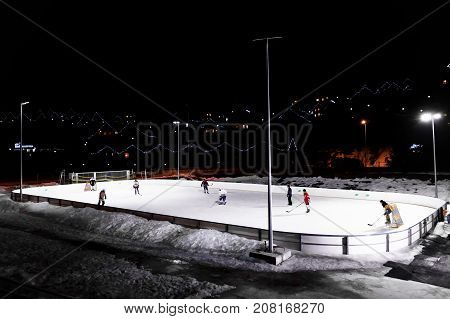 BUKOVEL, UKRAINE, March 06, 2017: hockey players play hockey on the ice rink in Bukovel, UKRAINE March 06 2017