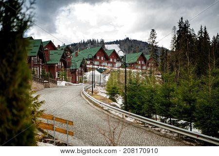 BUKOVEL, UKRAINE, March 06, 2017:  wooden houses in the Ukrainian resort Bukovel. winter landscape UKRAINE March 06 2017