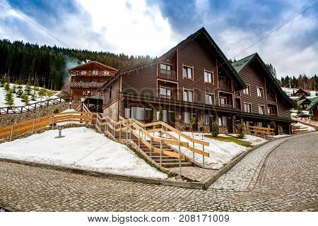 BUKOVEL, UKRAINE, March 06, 2017:  wooden houses in the Ukrainian resort Bukovel. winter landscape UKRAINE March 06 2017