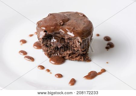 Sliced Chocolate Cup Cake Muffing With Topping Melting Chocolate Cream Above White Marble Background