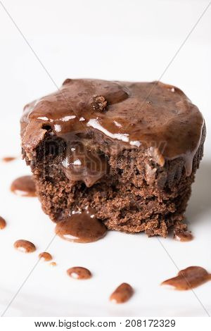 Sliced Chocolate Cup Cake Muffing With Topping Melting Chocolate Cream Above White Marble Background