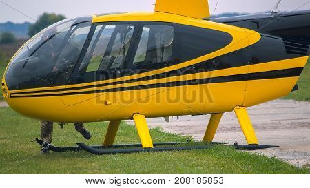 Yellow Vintage Helicopter On Stage. Close Up