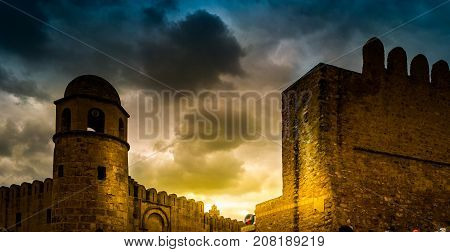 Photo of Mosque in Sousse. Medieval architecture of famous african city. Vivid picture of ancient religious building - one of the main attractions in Sousse, Tunisia.