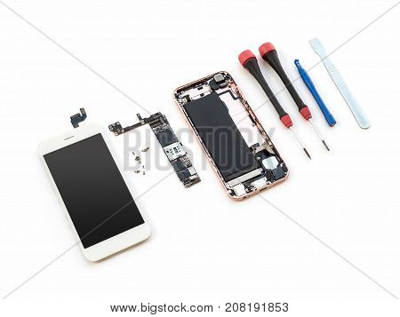 Disassembled broken smartphone preparing to repair or replace new part on white background