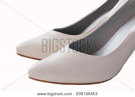 Close up on top of white leather high heel shoe isolated on white background.