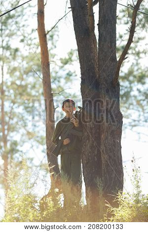 Child With A Gun Playing Laser Tag In The Forest