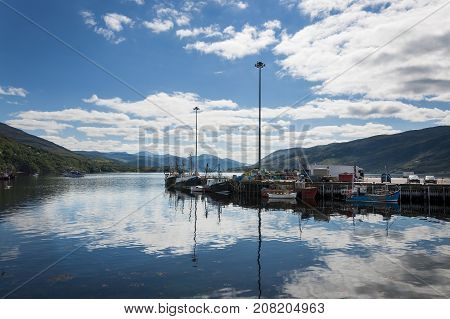 Ullapool Scotland - August 15 2010: Fishing boats in the port of Ullapool in the Highlands in Scotland United Kingdom