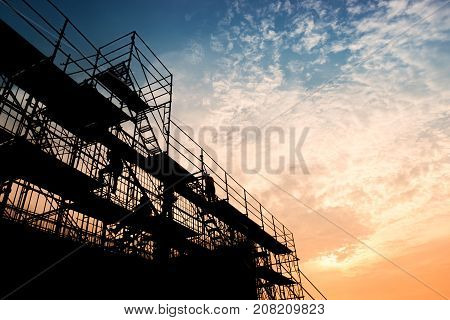 Civil engineer and safety officer in spec steel truss structure scaffolding risk analysis in construction site
