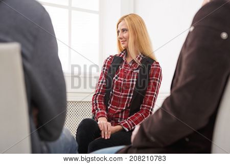 Meeting of support group. Young woman therapist listening to other people. Mental health, psychotherapy concept
