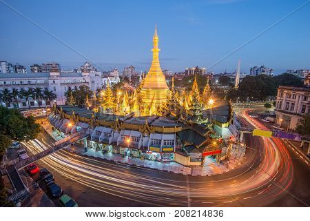 yangon the old capital city of myanmar.yangon traffic with long exposure at sule pagoda famous landmark after sunset yangonmyanmar