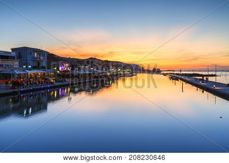 LEFKADA, GREECE - OCTOBER 1, 2017: Coffee shops and restaurants in the harbor of Lefkada town, Greece on October 1, 2017.