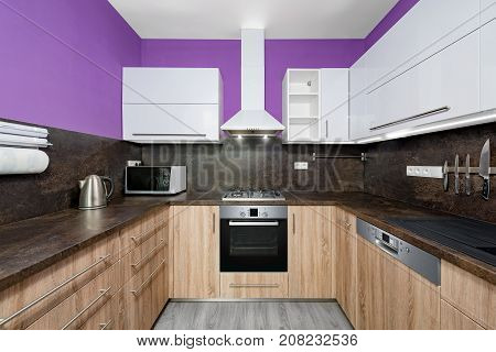 Modern kitchens combined with white and purple color and oak wood.