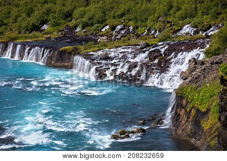 Hraunfossar series of waterfalls formed by rivulets streaming over a distance of about 900 metres