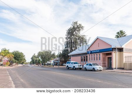 KEIMOES SOUTH AFRICA - JUNE 12 2017: A street scene with businesses and vehicles in Keimoes in the Northern Cape Province