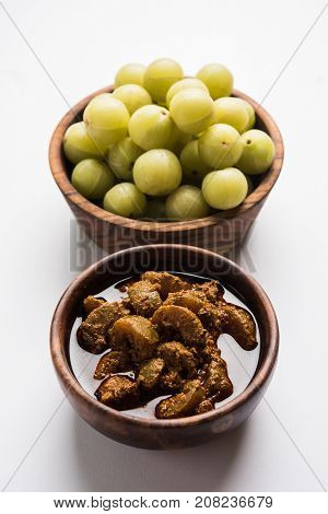 Stock photo of Amla/Avla/Aavla and it's by product called pickle or achar, selective focus