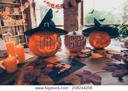 Close Up Of Cutted Pumpkins, Leaves, Spiders Nets, Head Wear Of Witch, Burning Candles, On Top Of Wo