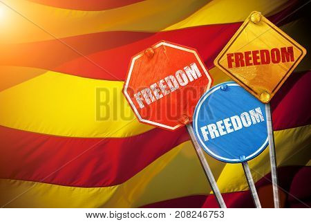 Political slogan in the form of traffic signs with Flag of Catalonia on the background. Signs with word FREEDOM. Independence of catalonia. Referernundum and protests in Catalonia, Barcelona.