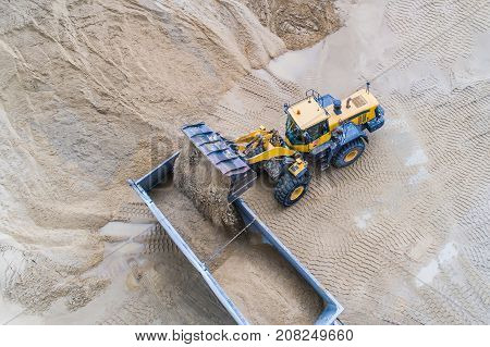 Wheel Loader Loading Sand On Dumper Truck