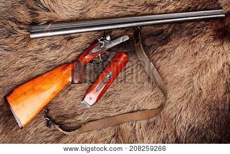 Old Double-barreled Shotgun, Disassembled, Gun On Wild Boar Furs.top View. Copy Space