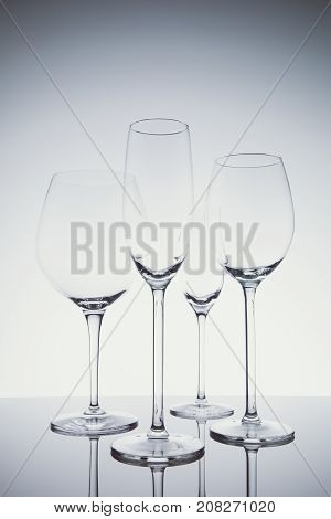 Glassware Selection With Wine, Champagne And Liquour Glasses  On The Light Background